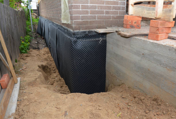 Happy homeowners after waterproofing job in Forkland